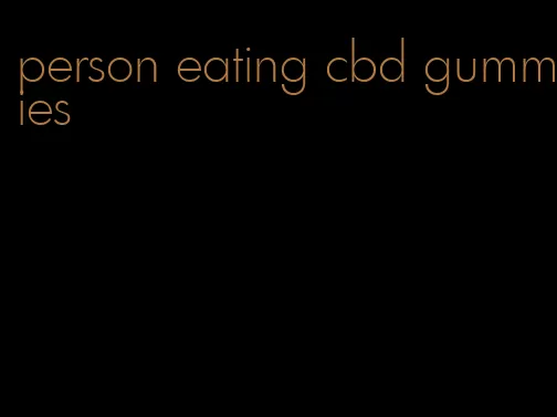 person eating cbd gummies